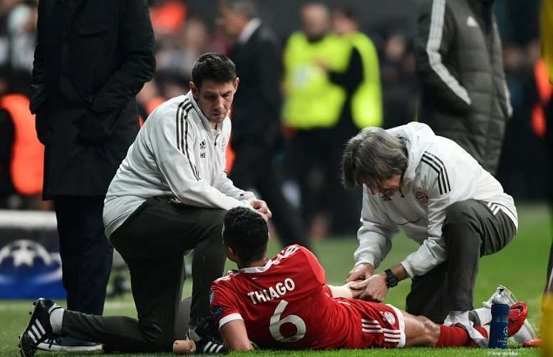 Alcantara is being checked by the medical staff for an injury against Besiktas in the Champions League.